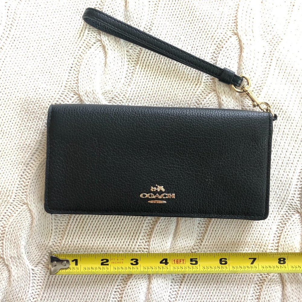 Bifold wallet with detachable wristlet strap